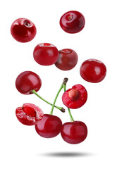 Fresh juicy cherries falling against white background