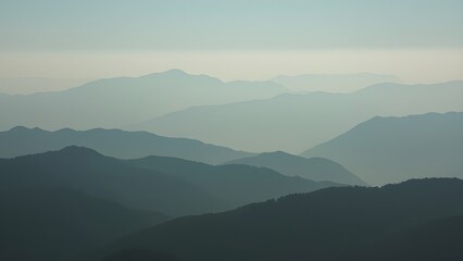 Obraz premium Misty Mountain Landscape: Nature's Beauty for Travel, Exploration, and Outdoor Adventures