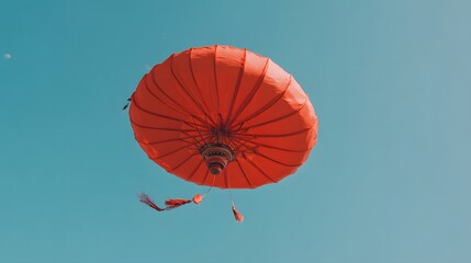 Vivid red lantern against a clear blue sky.