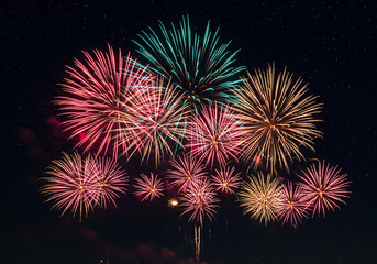 Spectacular colorful fireworks illuminate the night sky, perfect for celebrations, festivals, and vibrant backgrounds adding a burst of joy and excitement