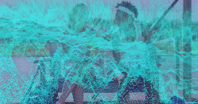 Working coworkers wearing casual attire, typing on laptops at office desk, with waveform overlay - Powered by Adobe