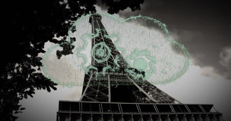 Showing Eiffel Tower rising in Paris skyline framed by branches, with neon cloud, gears and circui