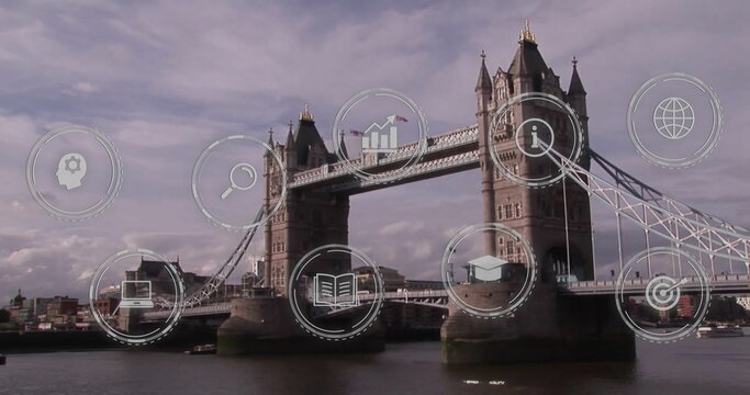 Fototapeta Showcasing Tower Bridge spanning River Thames at London riverside, with digital icons overlaying