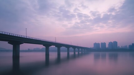 Obraz premium A Serene View of a Han River Bridge Under a Dreamy Pastel Sky Reflecting on Calm Waters.