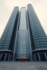 Obraz premium Modern skyscraper reaching towards the sky with impressive glass facade, a symbol of business and success