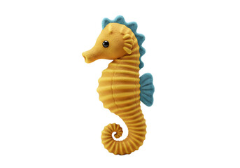 Fototapeta premium A yellow seahorse plush with a blue mane and fin stands on a white surface casting a soft shadow