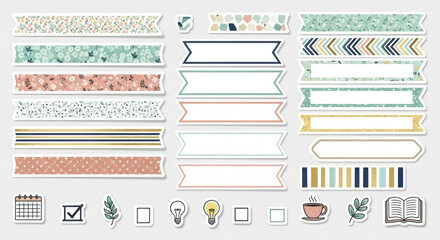 Assorted sticker sheet featuring patterned strips and planner icons on a white background surface