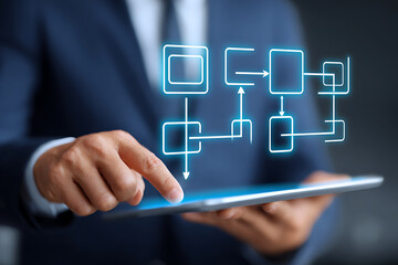 Business Professional Interacting With Tablet While Analyzing Digital Flowchart in Modern Office Setting