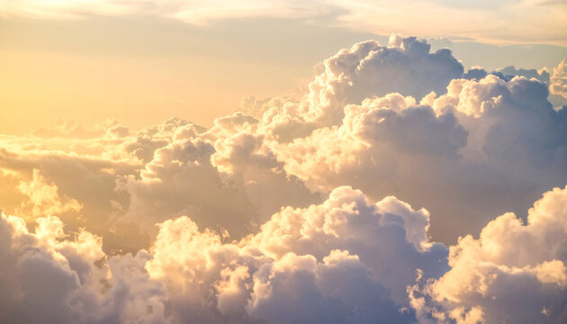 Cloudscape Serenity: Witness the majestic beauty of a cloudscape, where billowing clouds are illuminated by the golden sunlight, evoking feelings of peace and wonder.