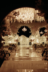 luxurious and elegant wedding altar decoration with white roses and dim lights 2