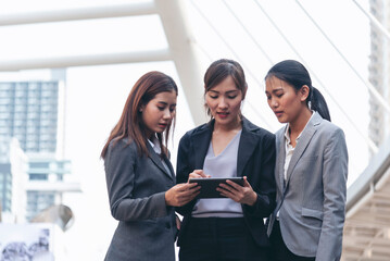 Businesswomen Partner use digital tablet online meeting team Partnership businesswoman talking...