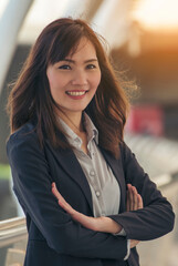 Vertical Horizon Asian Woman using laptop working from home online meeting in home office. Vertical Happy relax time asian business woman type keyboard notebook laptop at home office with copy space