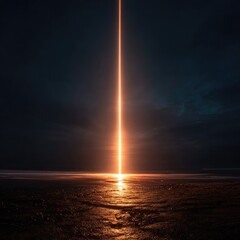 Bright orange beam pierces dark night sky over beach