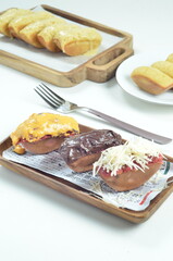 Pukis cake with various toppings of chocolate, cheese, peanuts, and matcha, a traditional Indonesian snack