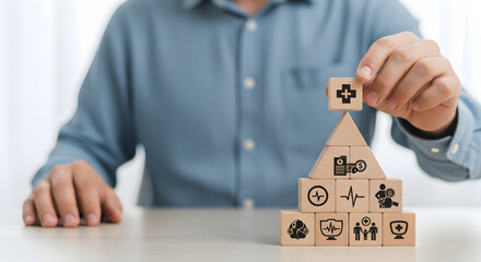 Pyramid of healthcare symbols stacked indoors, with a blurry background, for medical concepts