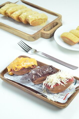 Pukis cake with various toppings of chocolate, cheese, peanuts, and matcha, a traditional Indonesian snack