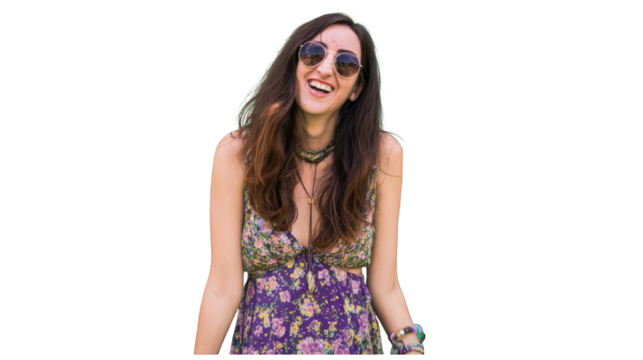 Joyful young woman with long brown hair laughing wearing round sunglasses and a purple floral bohemian dress.