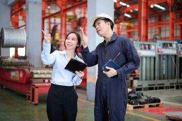Engineers or technicians talking about work in the factory