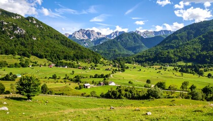 Majestic mountain landscape of a green valley under a clear blue sky in summer