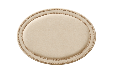 Round, light beige placemat with decorative stitching