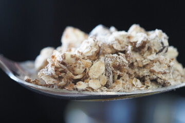 Spoonful of oats with flour for healthy baking