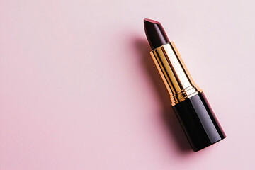 Fototapeta premium Elegant Lipstick with Rich Color on Soft Pink Background