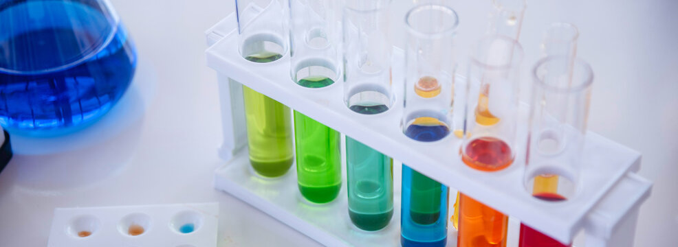 Banner Science laboratory chemistry test science lab with microscope glass tubes chemical beaker scientific background. Colorful Liquid biology laboratory fluid scientist experiment with copy space - Powered by Adobe