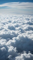 Cloudscape view from the window of an airplane flying above the clouds.