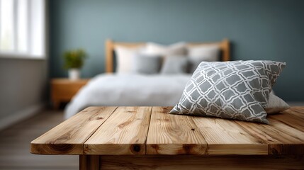 Cozy bedroom with textured pillows and wooden table