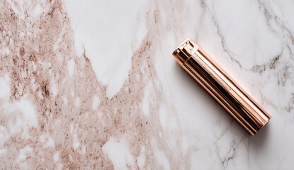 Rose gold cosmetic container on marble