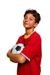 Confident teen holding soccer ball, smiling
