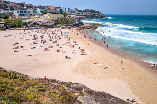 Tamarama beach. It is surrounded by high cliffs, with a deep tongue of sand with just 80m of shoreline and beautiful clear waters. Sydney, Dec 2019