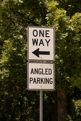One Way Street Sign Against Blue Sky on a Sunny Day