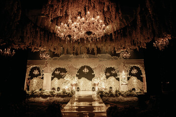 luxurious and elegant wedding altar decoration with white roses and dim lights 1