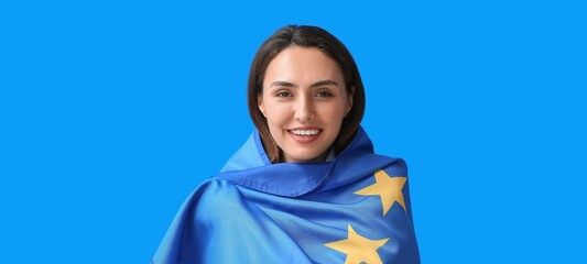 Young woman with flag of European Union on blue background