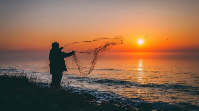 Silhouette of a fisherman casting a net at sunrise.