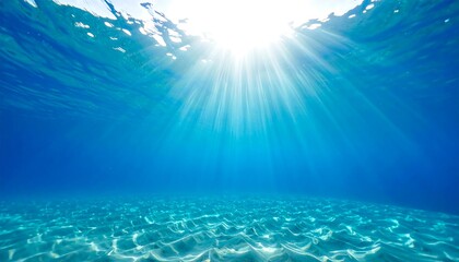 Underwater sunbeams dance on the tranquil seabed creating an ethereal spectacle