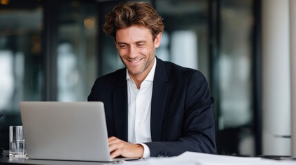 Focused business professional working on laptop in modern office environment capturing productivity and innovation