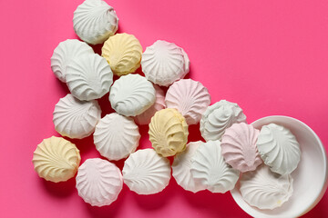 Bowl with sweet zephyr on pink background
