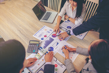 Business peoples meeting to discuss the situation on business plan, marketing for investment. Selected focus