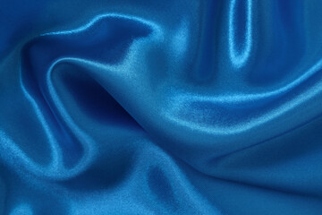 Blue fabric cloth texture for background and design art work, beautiful crumpled pattern of silk or linen.
