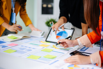 Business documents on office table with smart phone and calculator digital tablet and graph business with social network diagram