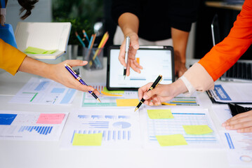 Business documents on office table with smart phone and calculator digital tablet and graph business with social network diagram