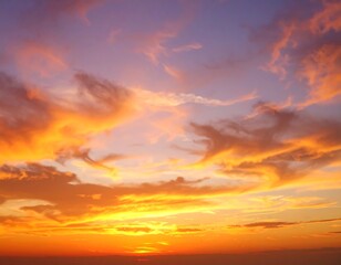 Vibrant sunset with fiery orange and purple clouds filling the sky