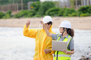 Scientists at Work in the Field, Environmental Scientists Collecting Water Samples for Analysis, Researchers Testing Water Quality at a Lake or Coastal Area