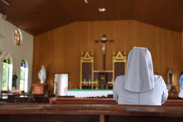 Landscape size picture of the interior of an empty roman catholic church