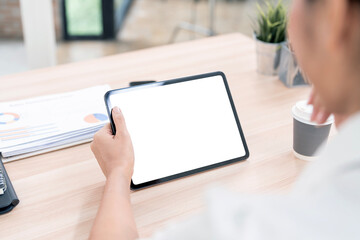 Mockup image of a woman holding black tablet pc with blank desktop white screen