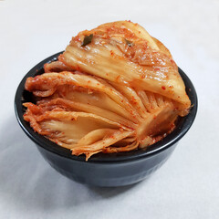 Delicious Traditional Korean Kimchi in a Black Bowl