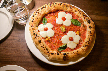 Pizza shop atmosphere, Flowers Mozzarella cheese pizza. 
Top view with selective focus,flower cheese pizza.