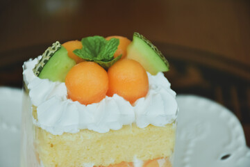 cake with fruits and cream. Close-Up Of Cake In Plate